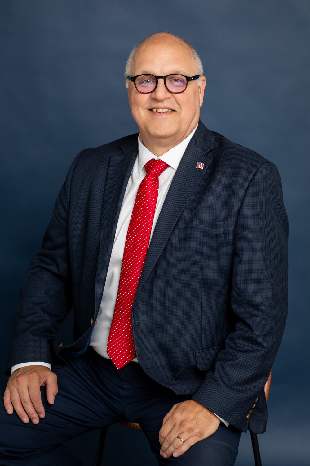 Steve Shoffner, Erie County Commissioner since January 2019, smiling in a dark suit and red tie, Republican candidate for re-election in November 2026
